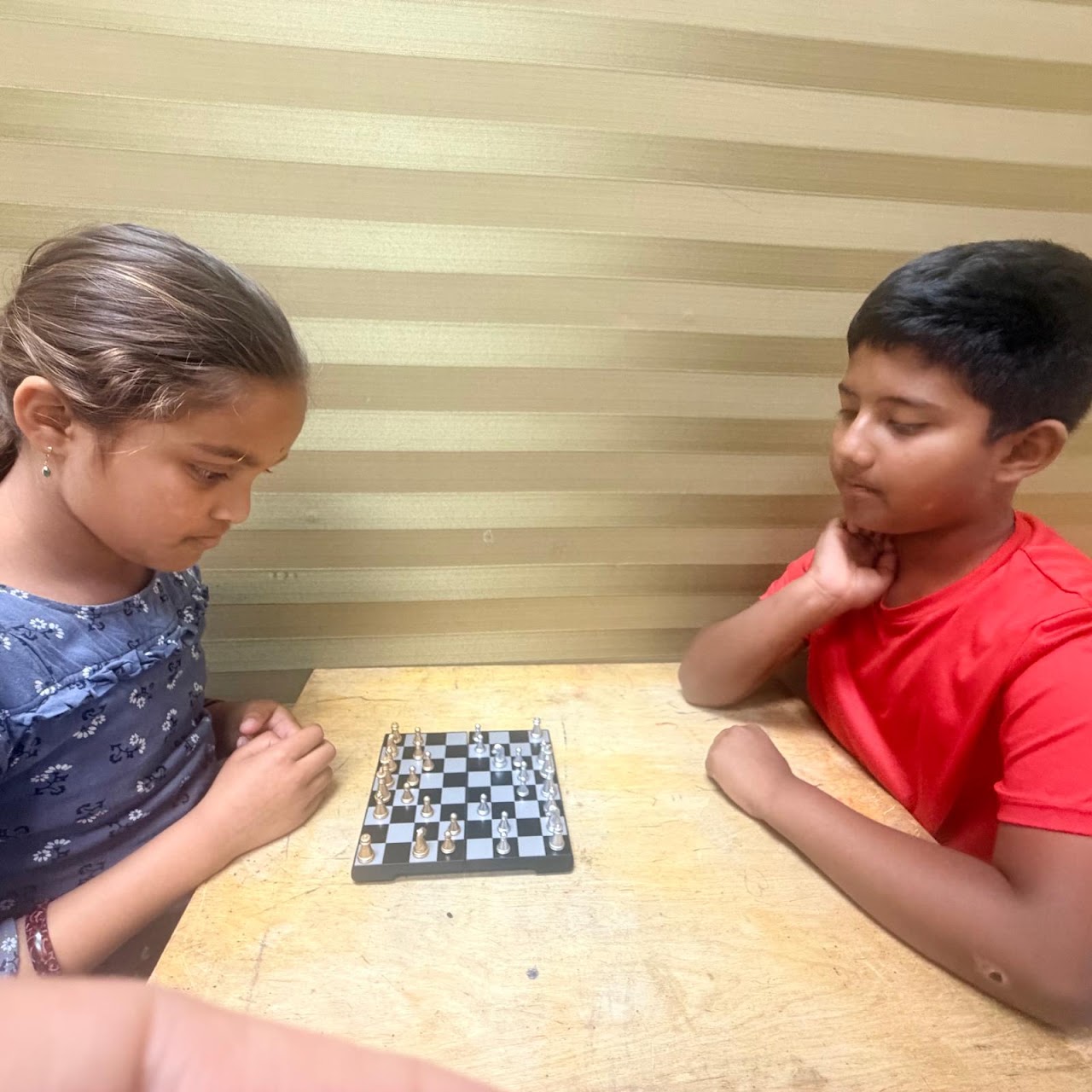 Two ElementX students thinking through a chess game together